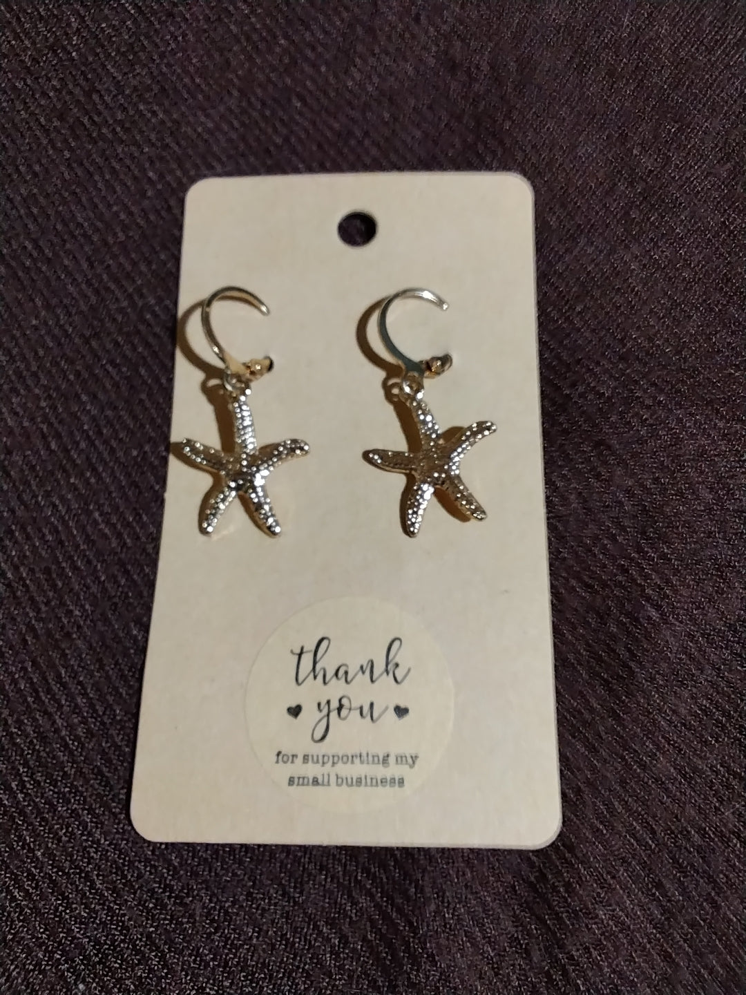 Gold starfish hoop earrings